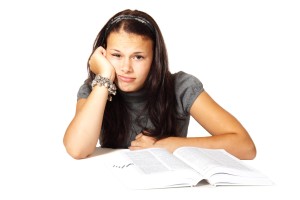 bored depressed student with book